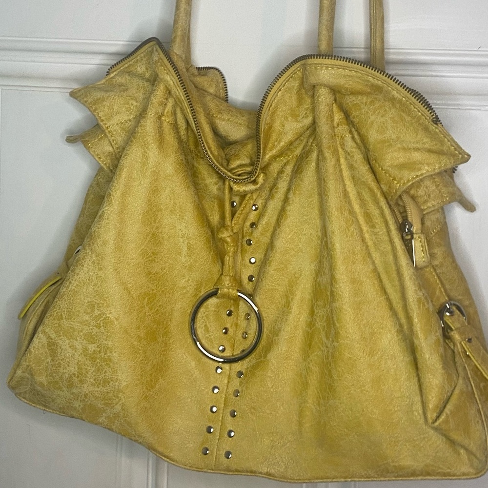 Shoulder bag in mustard yellow. Tiny sliver studs in 2 rows down center of front